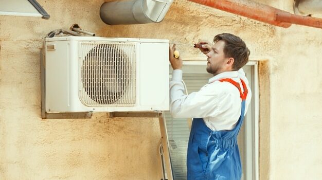 hvac-technician-working-capacitor-part-condensing-unit-male-worker-repairman-uniform-repairing-adjusting-conditioning-system-diagnosing-looking-technical-issues_155003-18258
